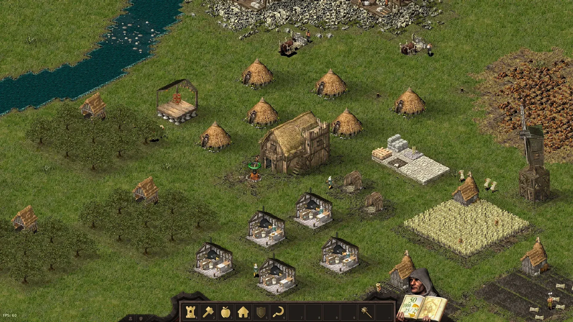 Escena de una aldea medieval del juego de fans 'Stone Kingdoms' basado en Stronghold. La imagen muestra chozas, un granero, un campo y un río, representando un entorno rural típico.