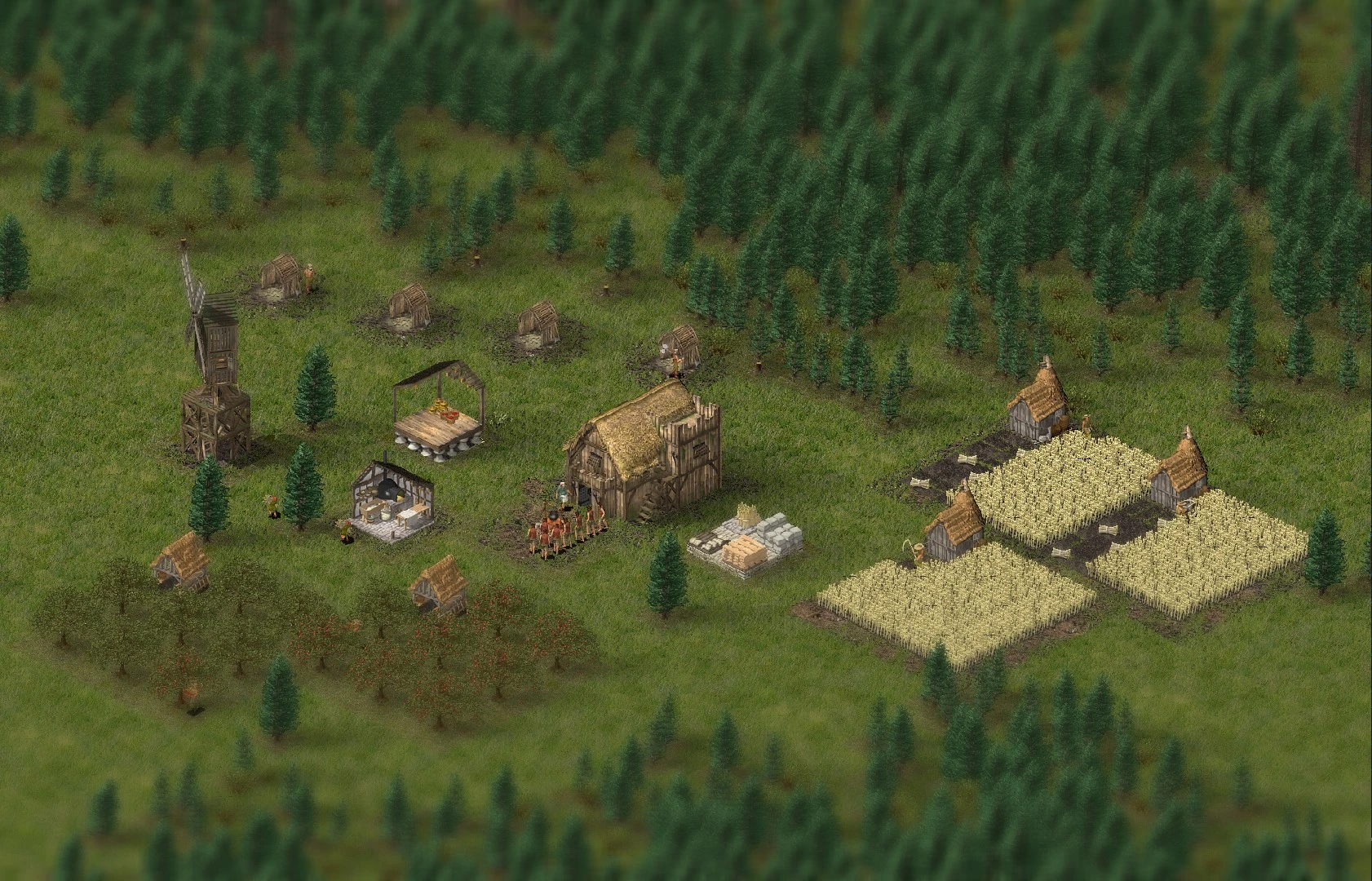 Escena de una aldea medieval del juego de fans 'Stone Kingdoms' basado en Stronghold, con un molino de viento, casas y campos rodeados de un bosque.
