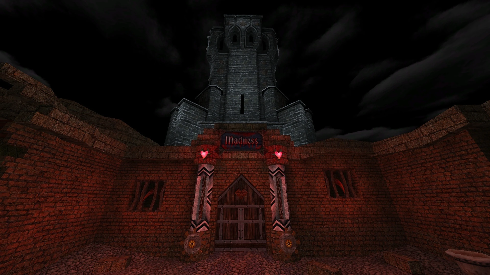 Stone fortress entrance at night with wooden doors and glowing Madness sign above in Alice Dreamland mod