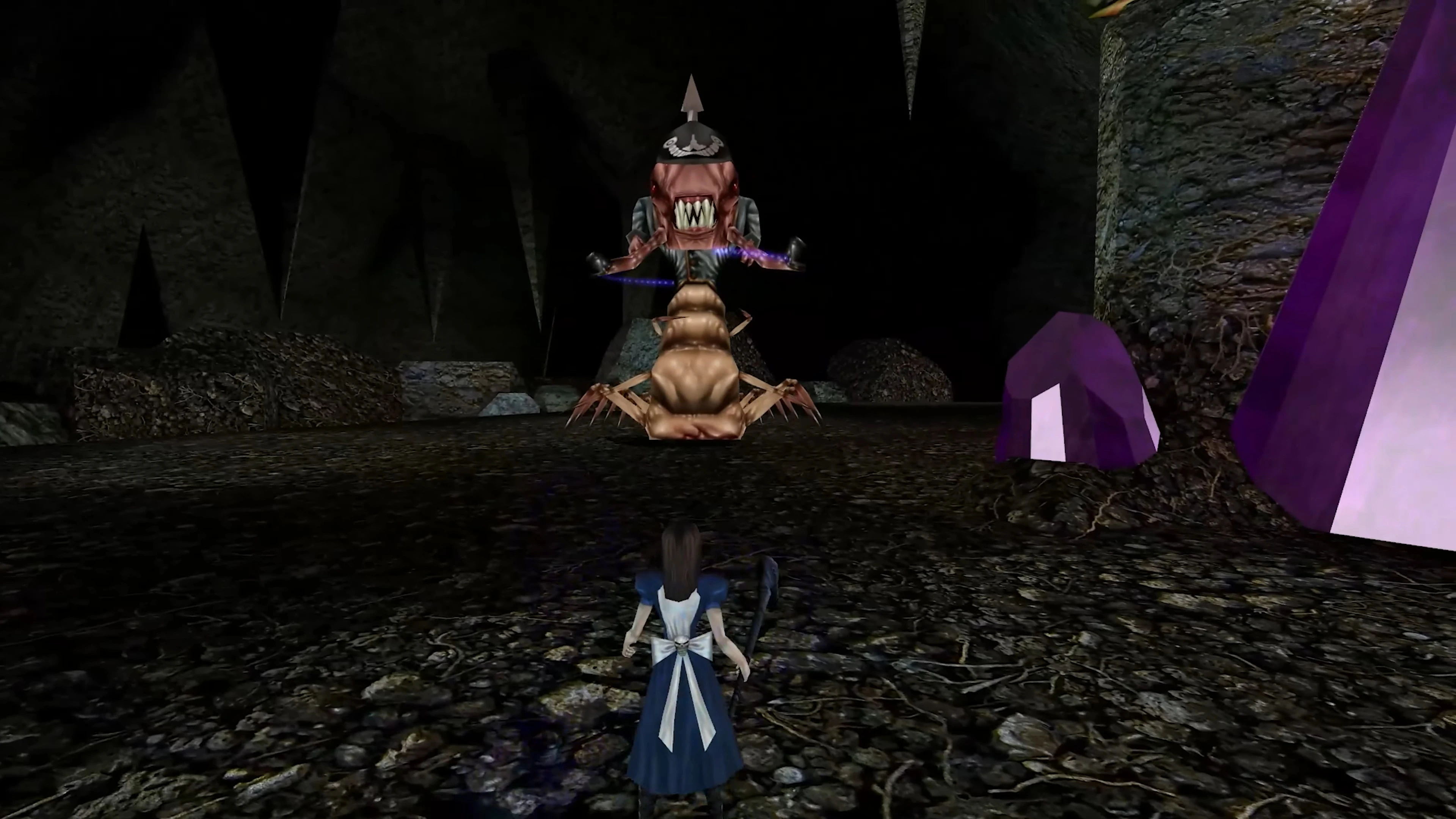 Player character Alice facing a large monster in a dark cave with purple crystals in American McGee's Alice HD