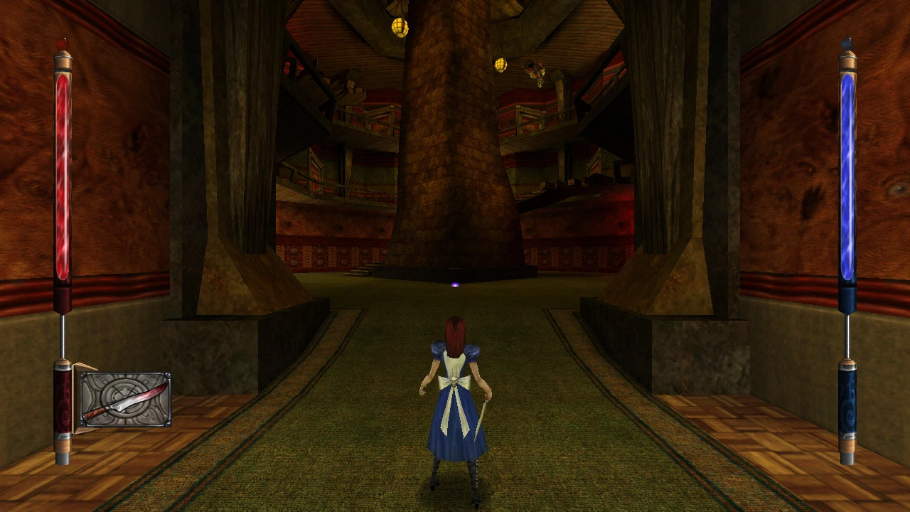 Third-person view of Alice holding a knife in a large indoor area with dark stone walls and stairs