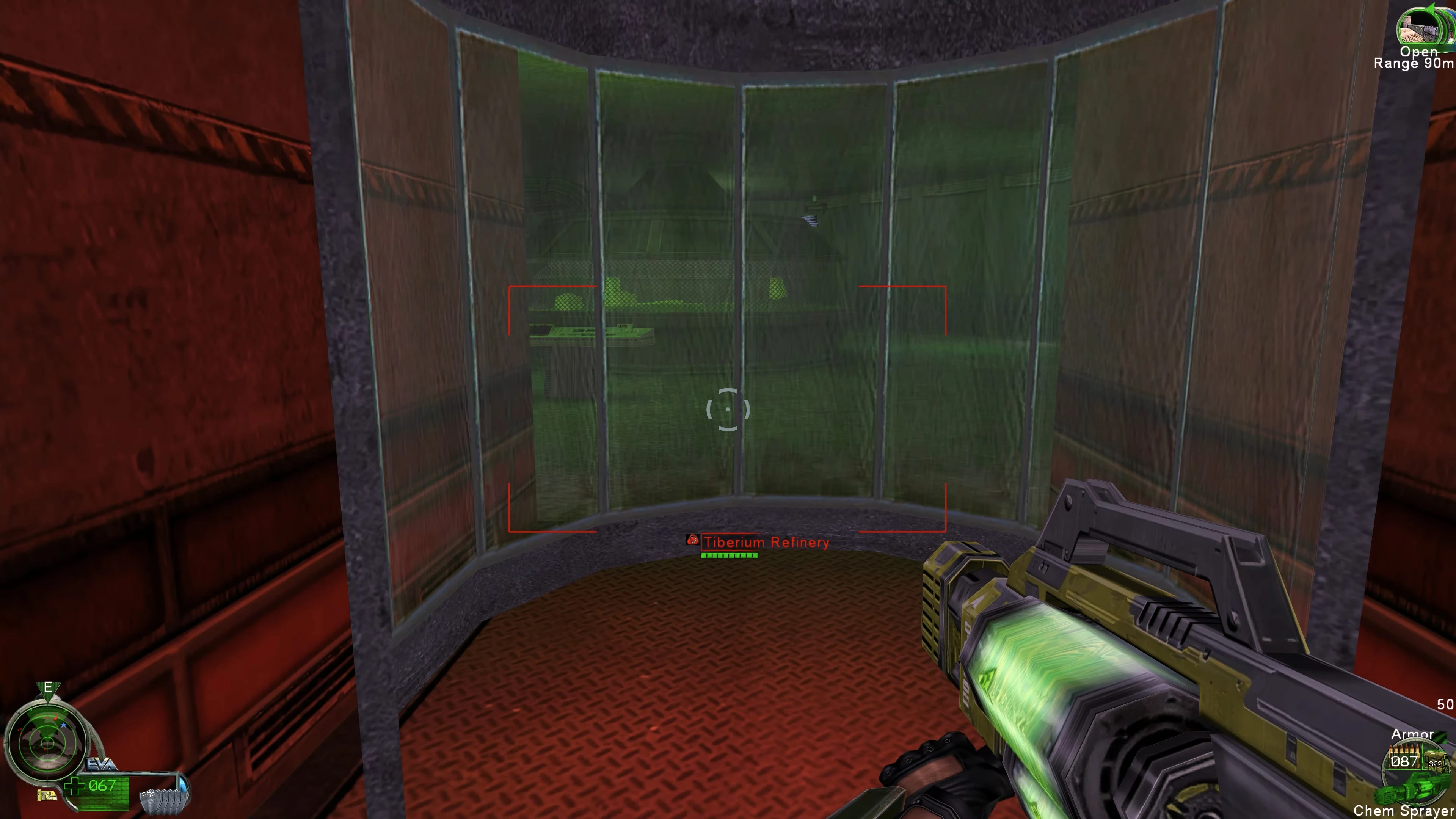 Гравець тримає хімічний розпилювач, дивлячись через зеленувате скло на Tiberium Refinery з покращеними текстурами мода