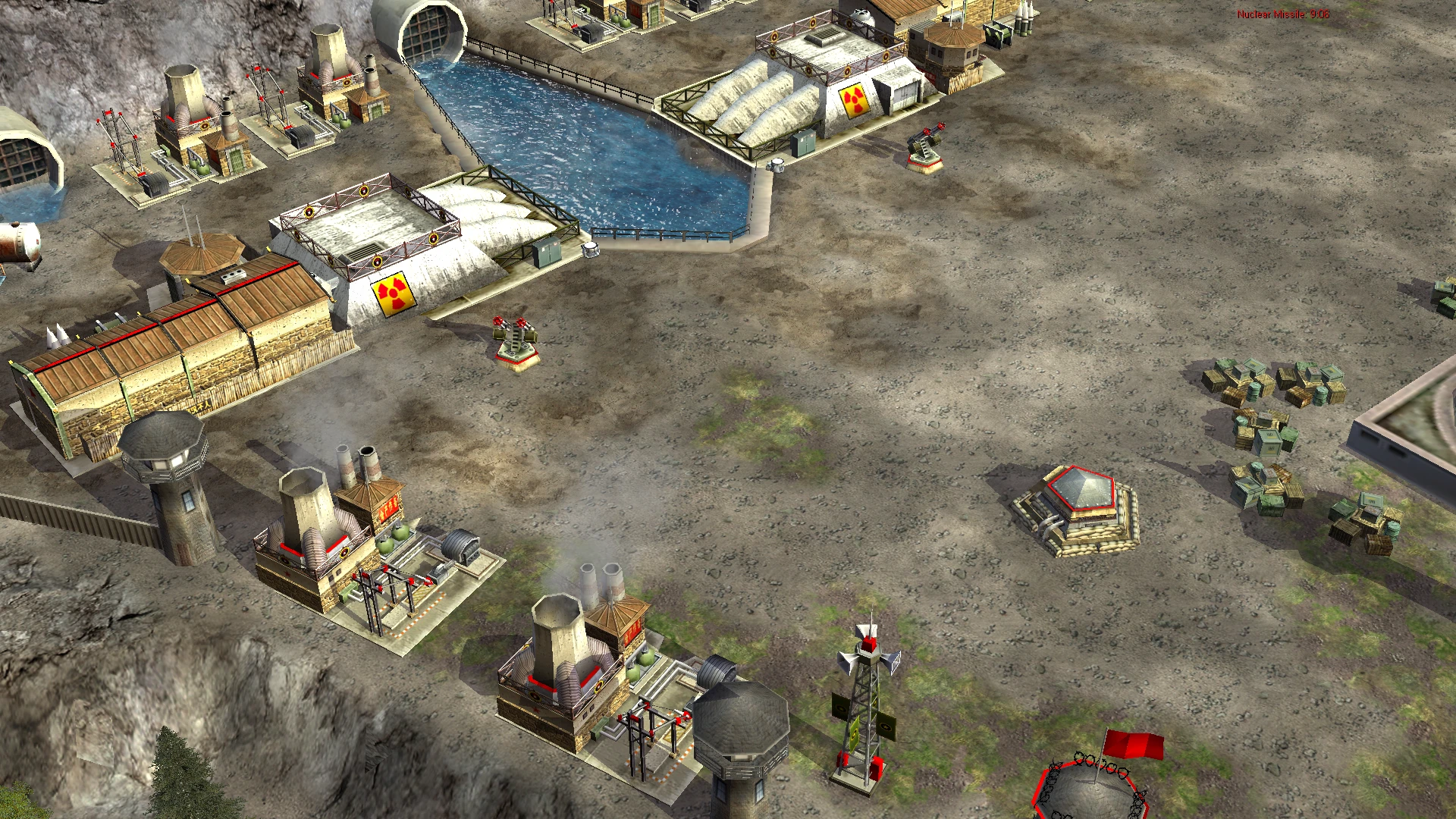 Вигляд згори на укріплену базу з ядерними знаками та оборонними турелями в моді Command & Conquer Generals