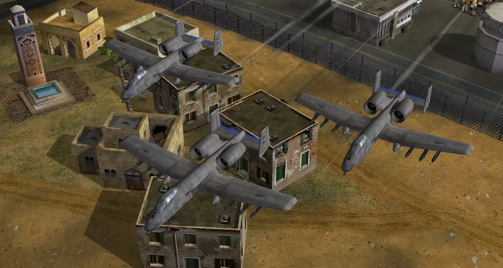 Drei A-10 Warthog-Flugzeuge fliegen niedrig über Gebäuden in einer Wüstenumgebung im Command & Conquer Generals Visual Reality Mod