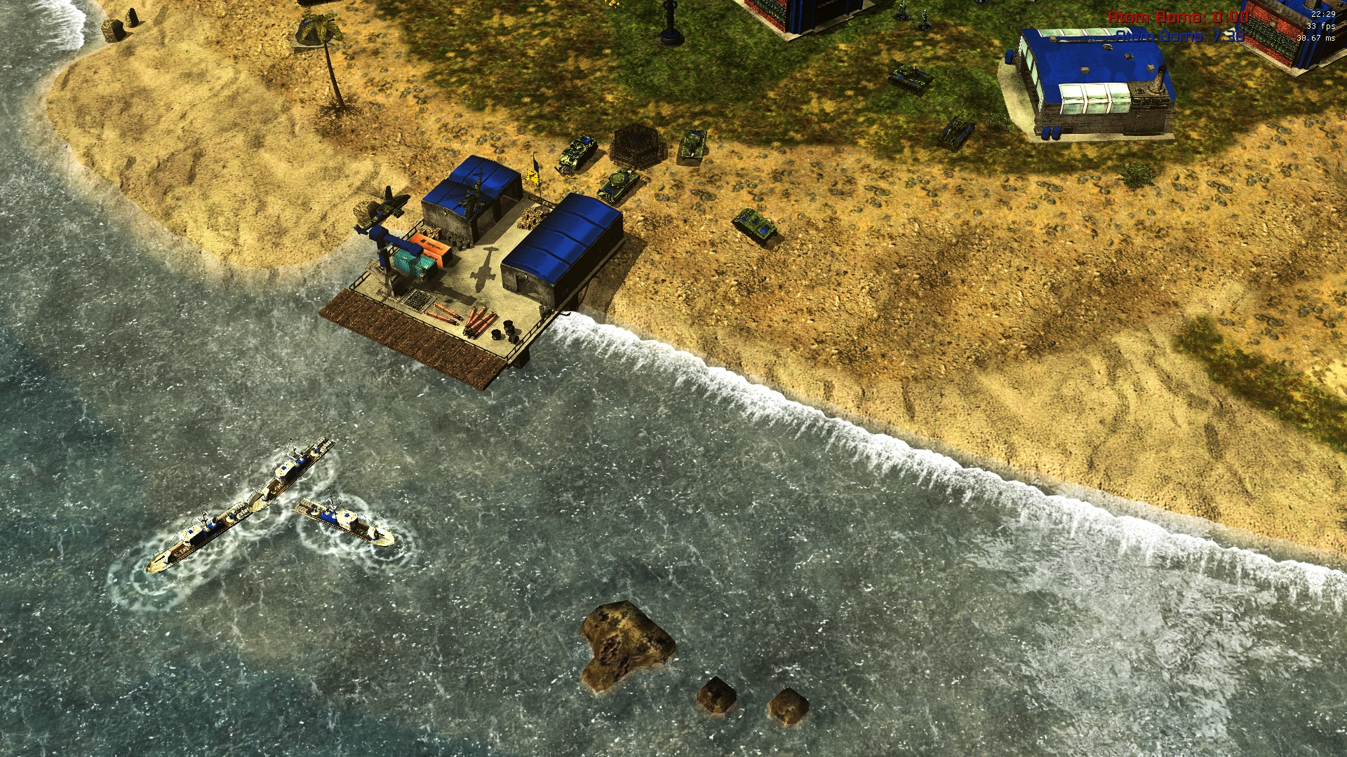 Top-down view of a sandy coastal base with military tanks, patrol boats, and buildings in Command & Conquer mod