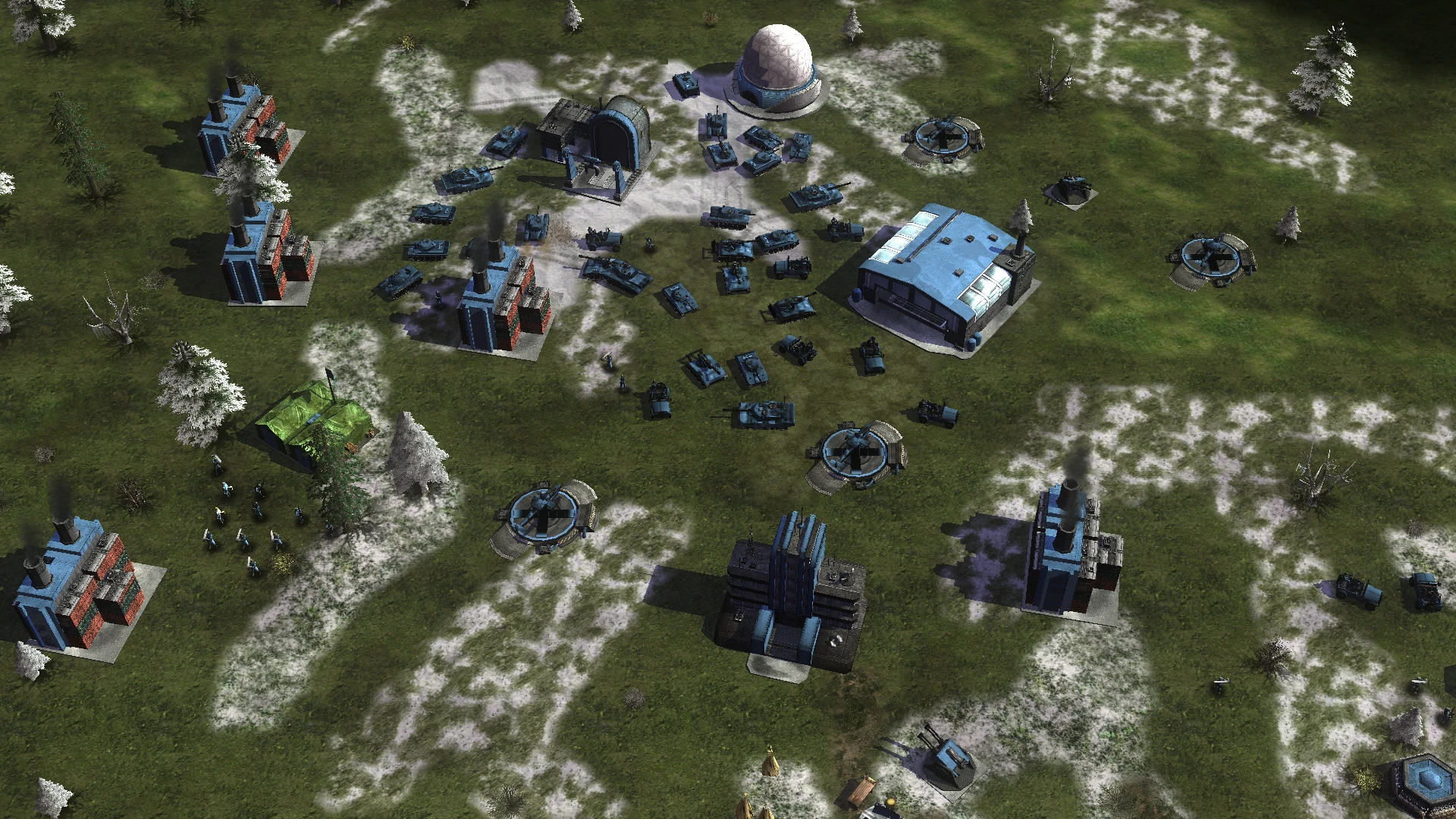 Overhead view of a blue faction base with several tanks, infantry units, and buildings in snowy terrain