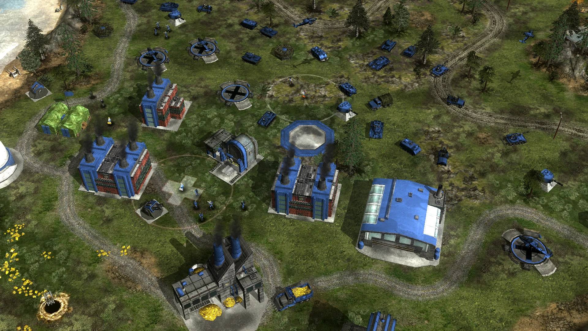 Top-down view of a Command & Conquer Generals base featuring blue buildings, vehicles, and infantry units in the C&C Red Alert Redux mod