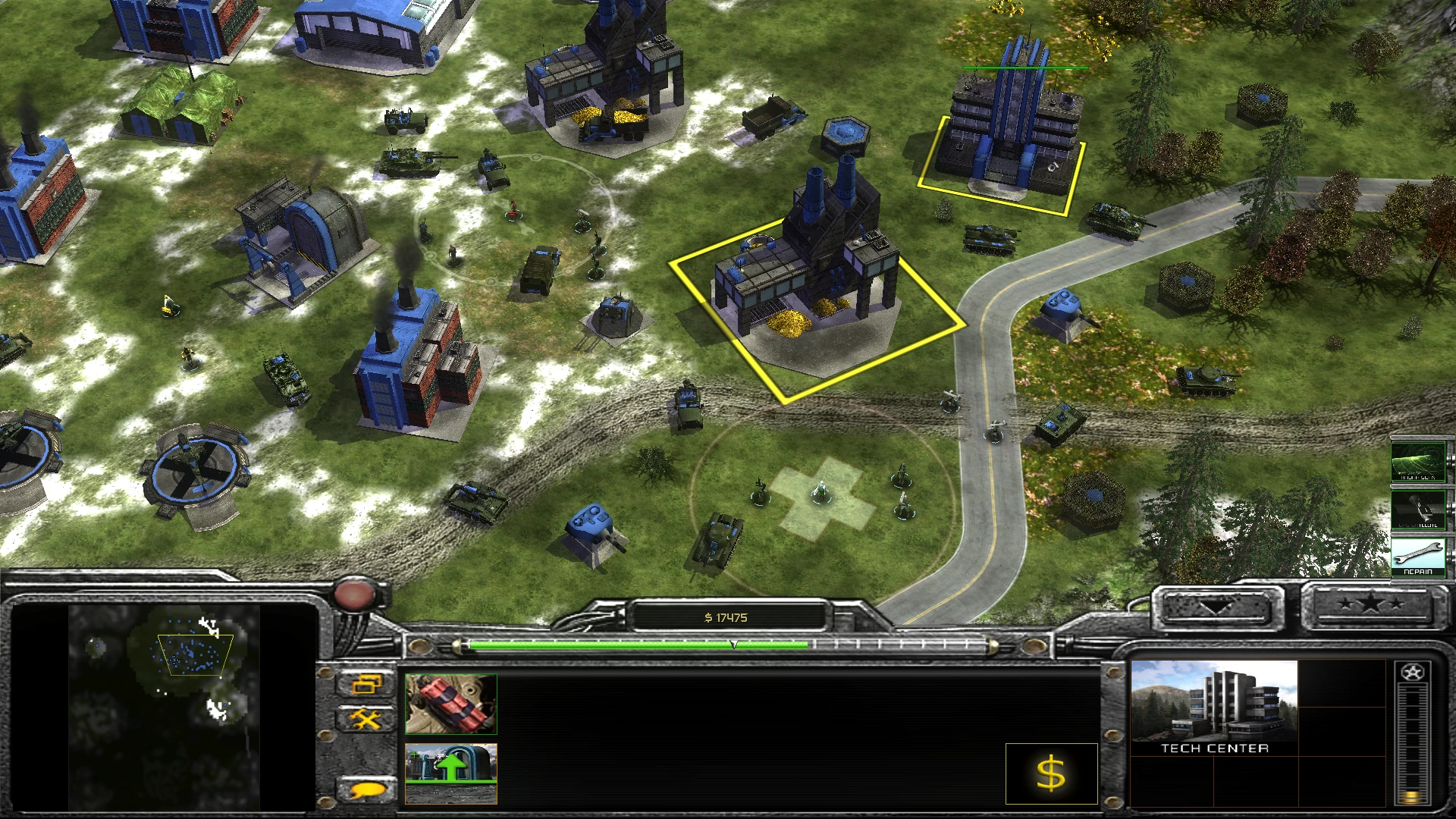 Top-down view of Command & Conquer Generals gameplay showing tech center building, infantry and vehicles on grassy terrain