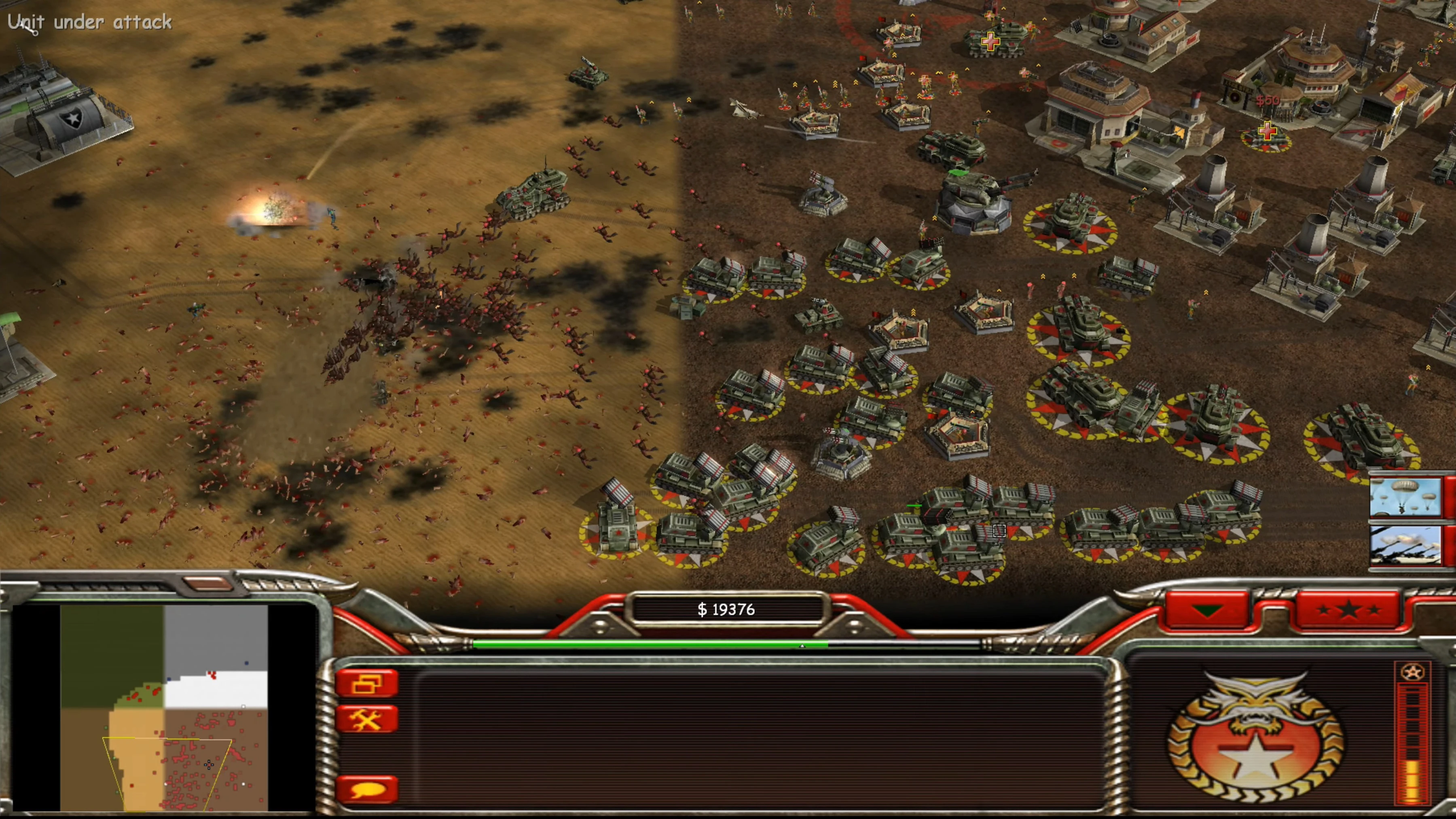 Command & Conquer Generals Screenshot zeigt zahlreiche Panzer und Infanterie im Kampf mit der Meldung „Unit under attack“
