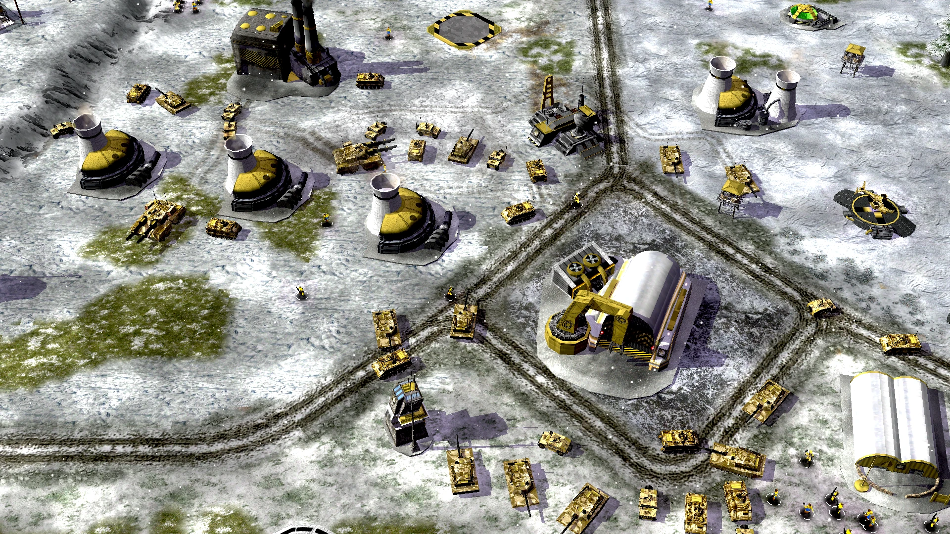Top-down view of a snowy military base featuring tanks, buildings, and roads in C&C Tiberian Dawn Redux