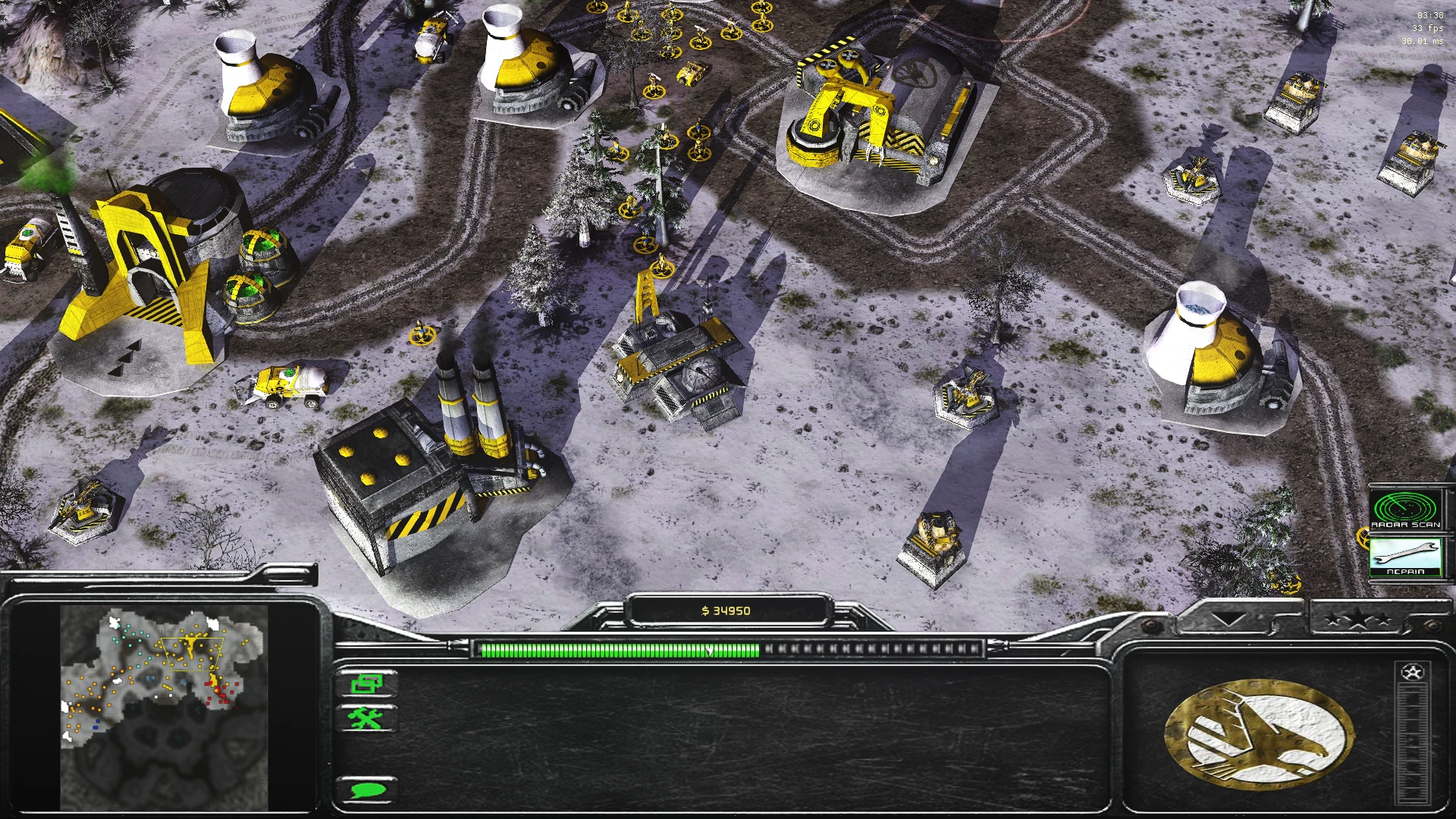 Overview of snowy Command & Conquer Generals base with yellow buildings and units under Tiberian Dawn Redux mod