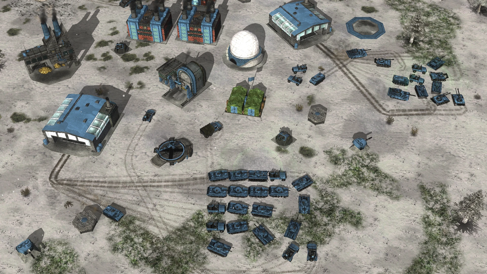 Overhead view of snowy base with numerous blue tanks and military buildings in Command & Conquer Generals mod