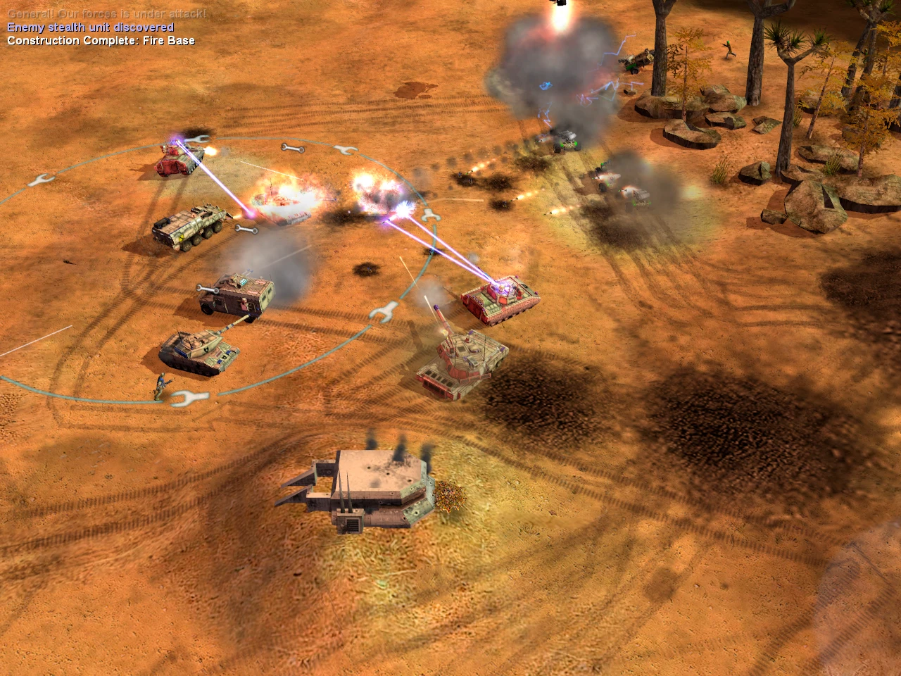 Вид зверху: лазерні танки та бронемашини обмінюються вогнем на пустельному полі бою з димом та вибухами