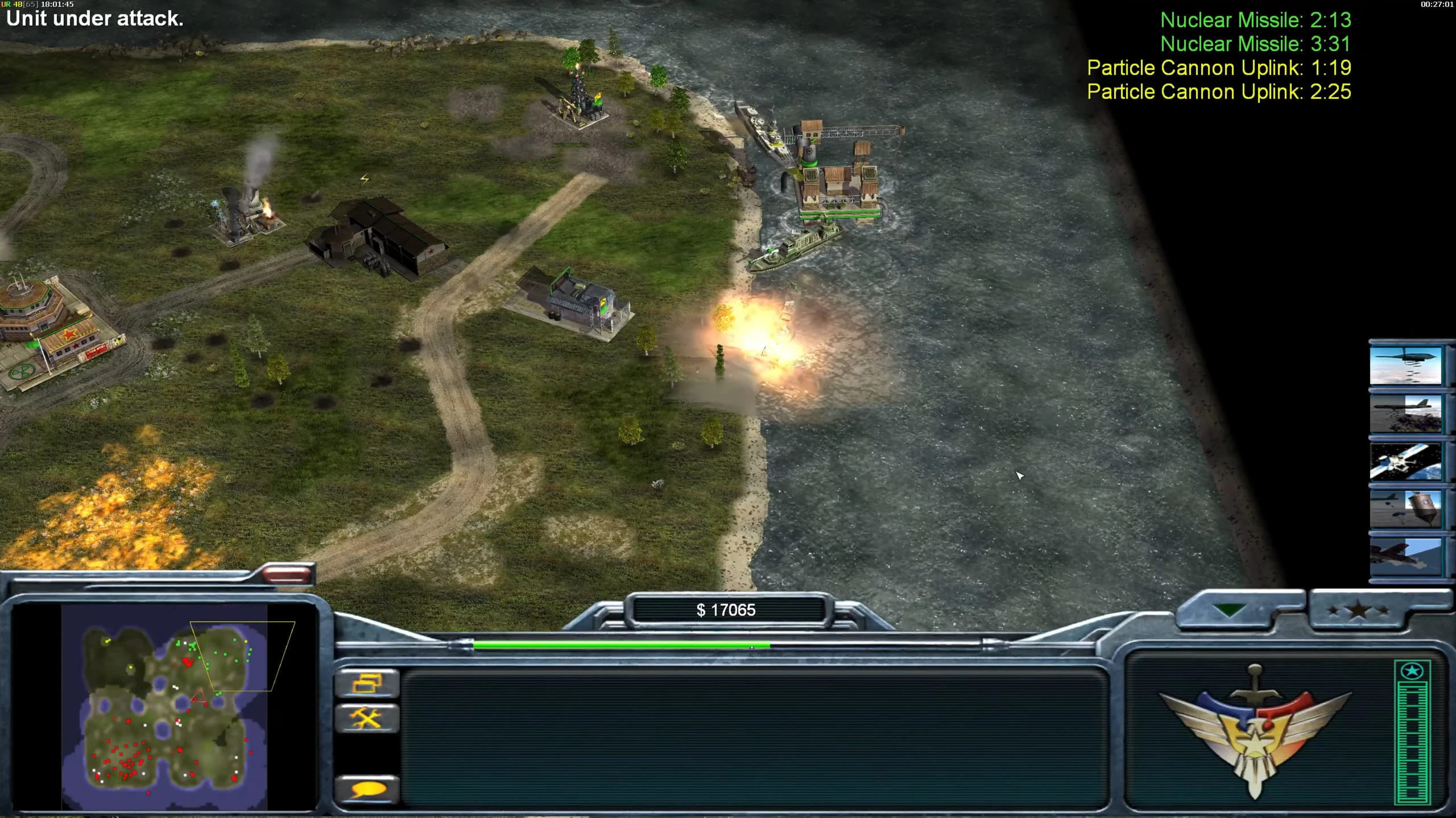 Screenshot of coastal military base with explosions and units at sea in Command & Conquer Generals Zero Hour mod
