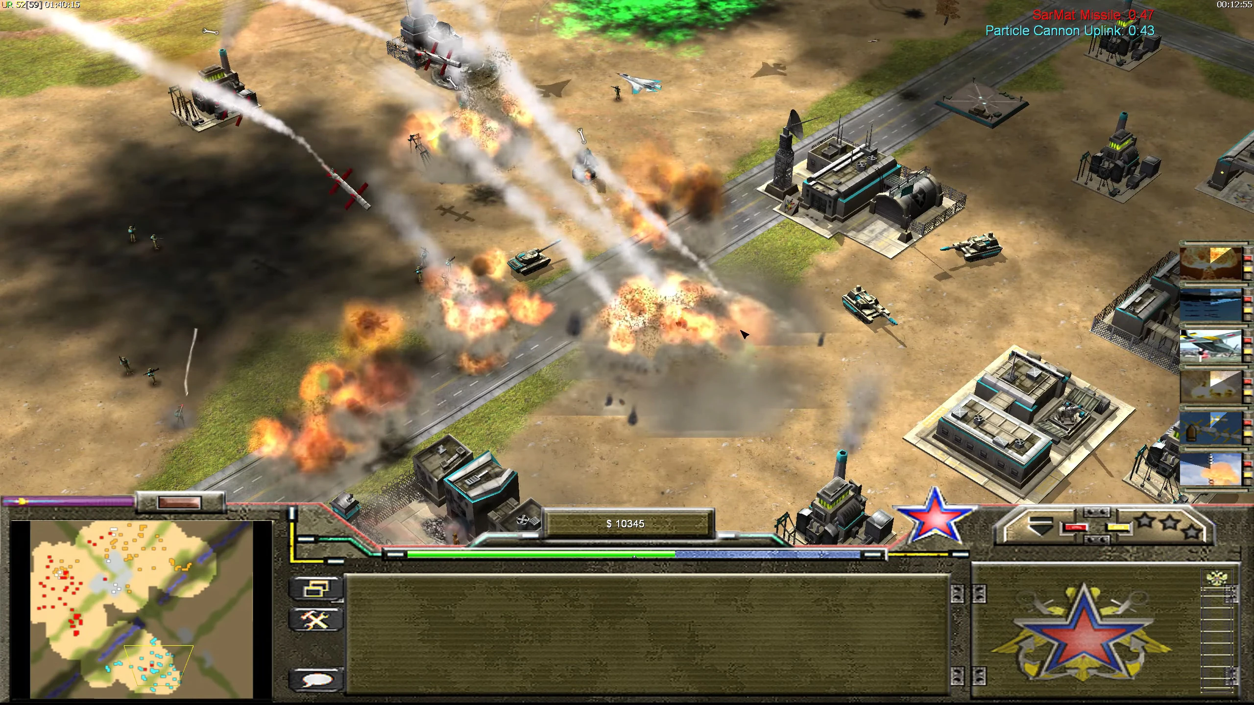 Explosions and missile trails over base with tanks and buildings in Command & Conquer Generals Zero Hour mod