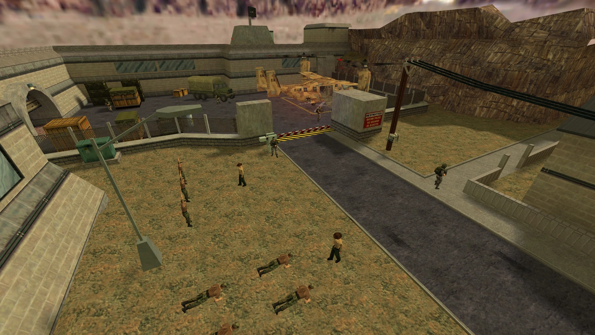 Spielansicht von Soldaten in Formation und Training nahe einem Hubschrauber auf Militärbasis im Half-Life Recon Mod