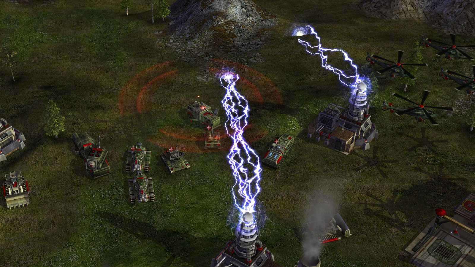 Zrzut ekranu pokazujący cewki Tesli emitujące łuki elektryczne broniące budynków i jednostek w modzie Command & Conquer Generals Operation Firestorm