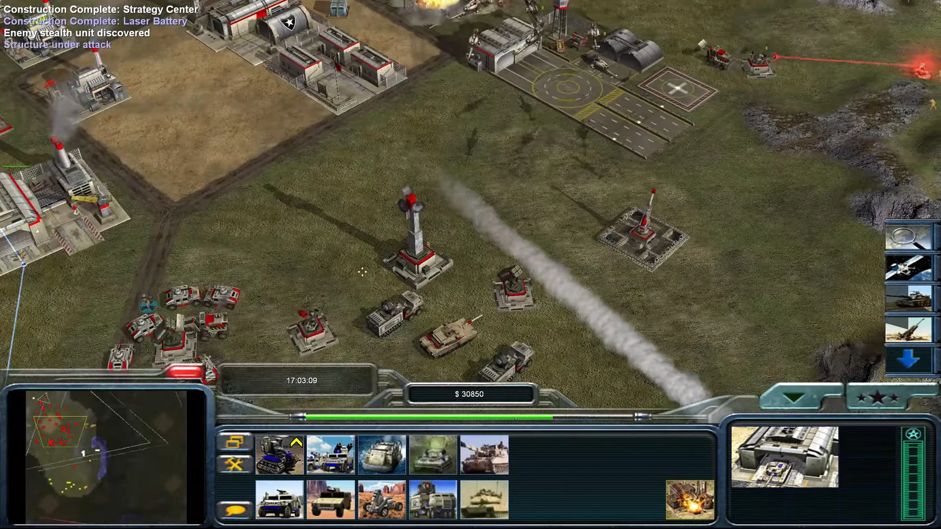 Vista del juego mostrando estructuras base, tanques y batería láser disparando en el mod Return de Command & Conquer Generals