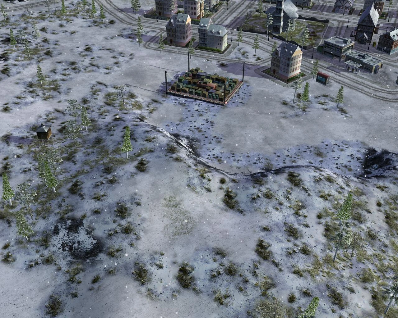 Snowy landscape in Command & Conquer Generals showing sparse trees, a container yard, and city buildings under snowfall