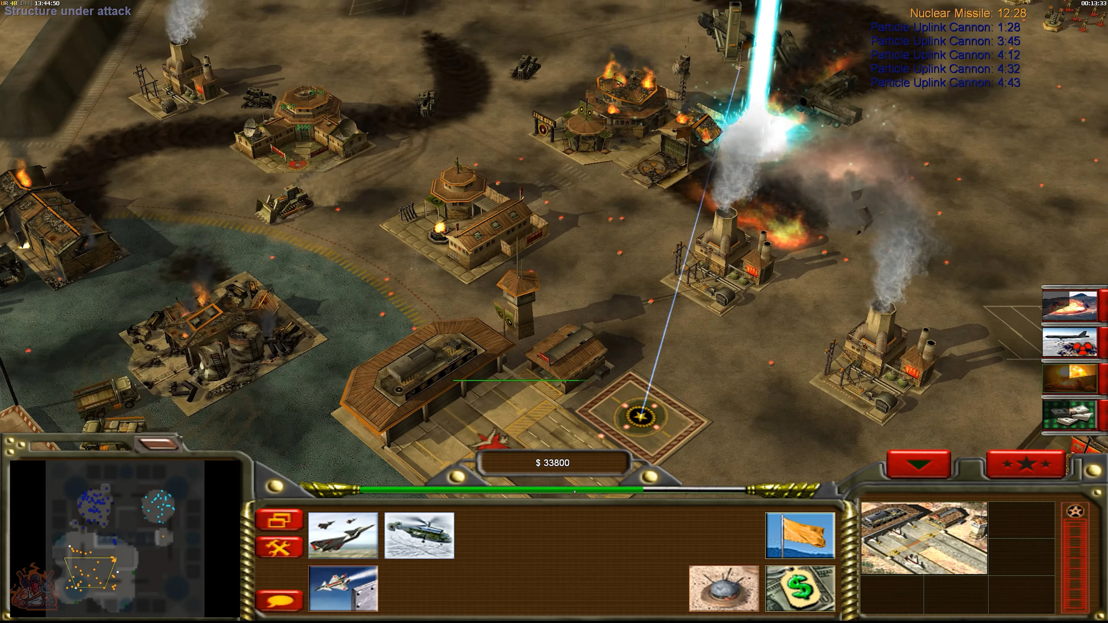 Command & Conquer Generals gameplay showing base under attack with missile strike and multiple structures burning