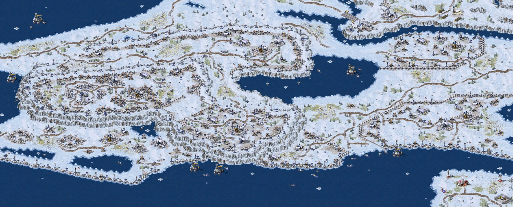 Draufsicht auf verschneites Gelände mit Basen, Straßen und Wasser im Command & Conquer Red Alert 2 Mod