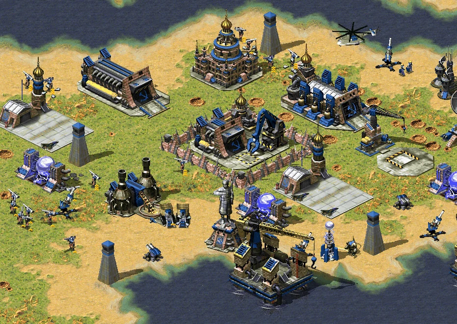 Vista superior de una base de Command & Conquer Red Alert 2 con edificios, infantería y vehículos cerca del agua en el mod Scorched Earth