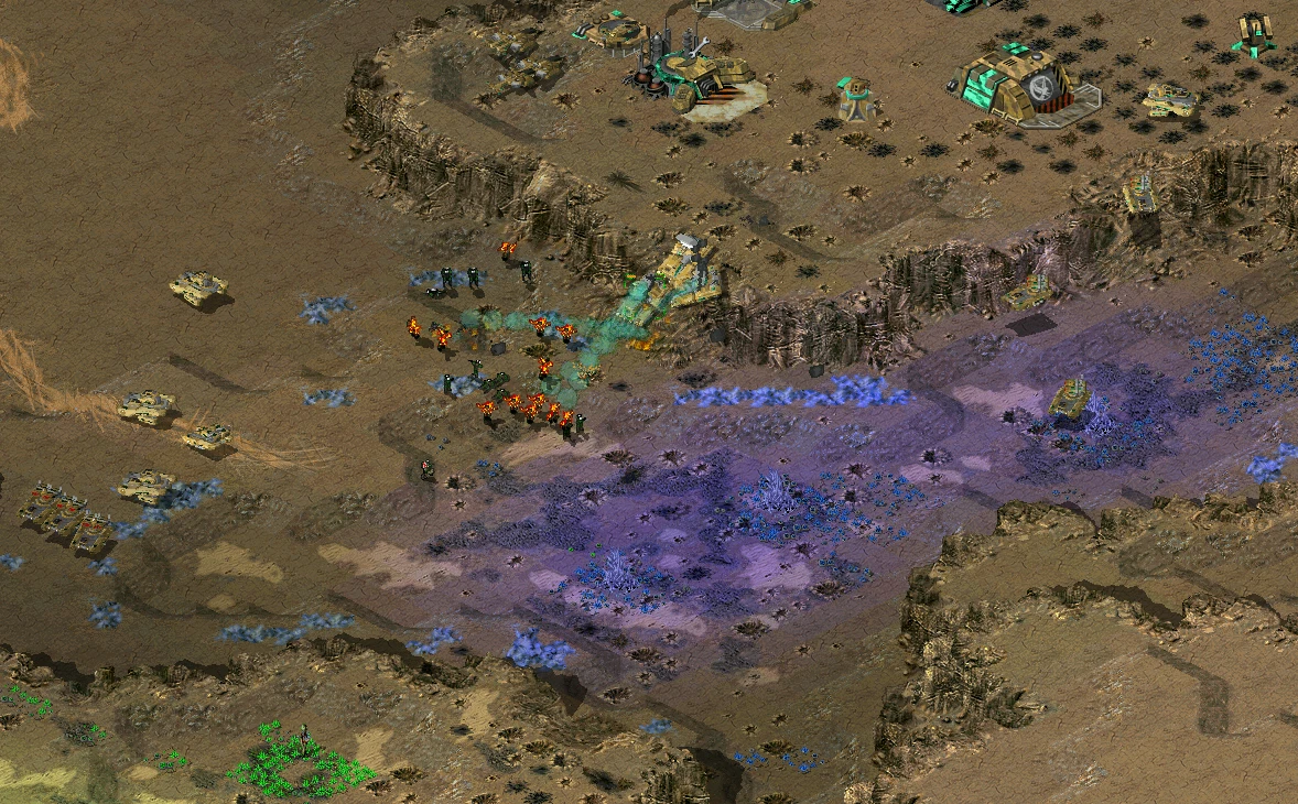 Top-down view of a large-scale battle with infantry and tanks on rugged terrain in the C&C Tiberian Odyssey mod