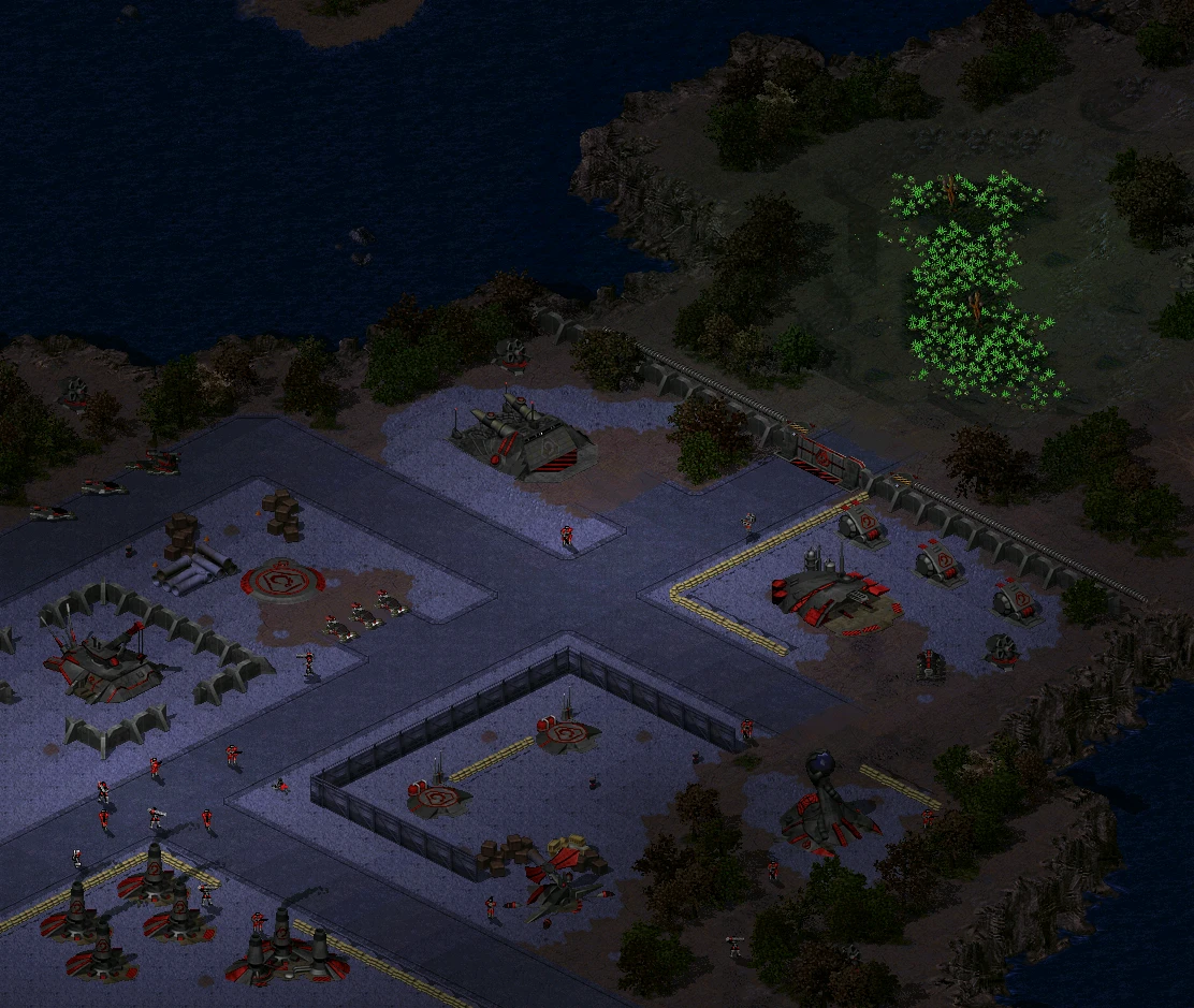 Top-down view of futuristic military base with defensive structures and units near water in C&C Tiberian Odyssey mod