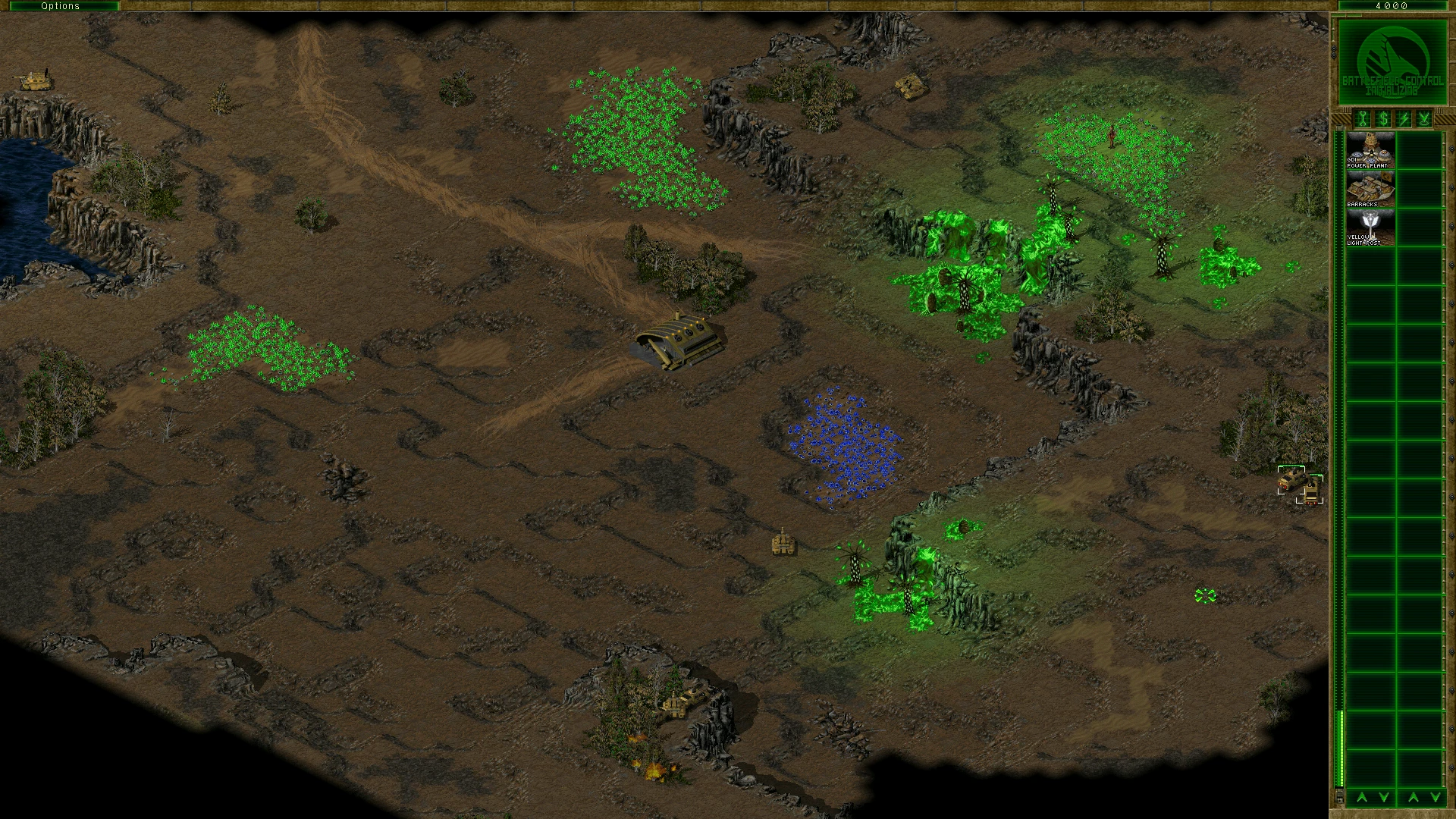 Скріншот мода Command & Conquer Tiberian Sun із базою Нод, зеленими та синіми полями Тіберію на кам'янистій місцевості