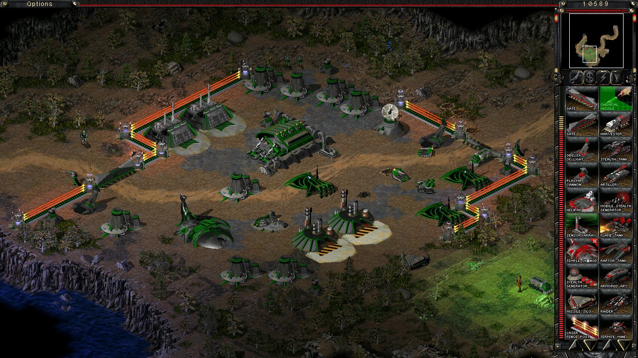 Command & Conquer Tiberian Sun Screenshot zeigt befestigte Basis mit grünen Gebäuden, Laserzäunen und Einheiten aus The Second Tiberium War Mod