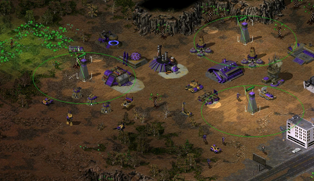 Command & Conquer Tiberian Sun Screenshot zeigt eine befestigte Basis mit violetten Gebäuden, Verteidigungstürmen und Einheiten im The Second Tiberium War Mod
