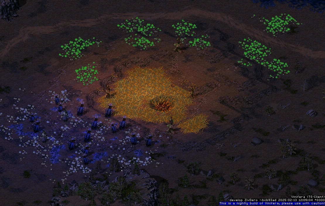 Scena z gry Command & Conquer Tiberian Sun z ciemną uszkodzoną ziemią i świecącymi zielonymi oraz niebieskimi roślinami