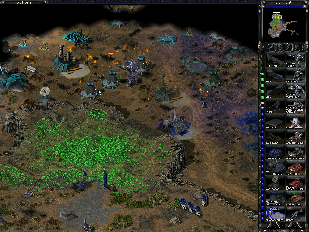 Spielbildschirm zeigt detaillierte futuristische Basis mit Fahrzeugen, Gebäuden und Tiberiumfeldern im Command & Conquer Tiberian Sun Mod
