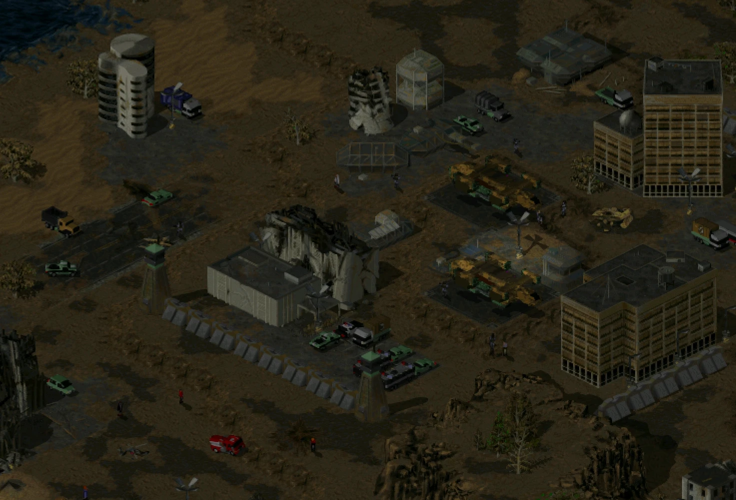 Vista aérea de una base fortificada con vehículos militares, construcciones y terreno en el mod Tiberian War WarZone