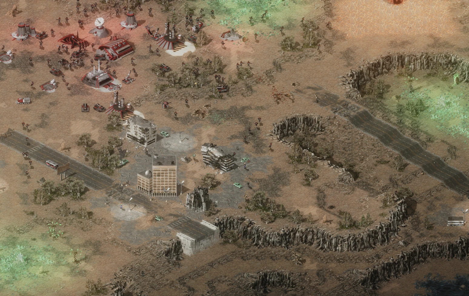 Vista desde arriba de un campo de batalla con estructuras Nod, infantería, vehículos y terreno en mod de Tiberian Sun