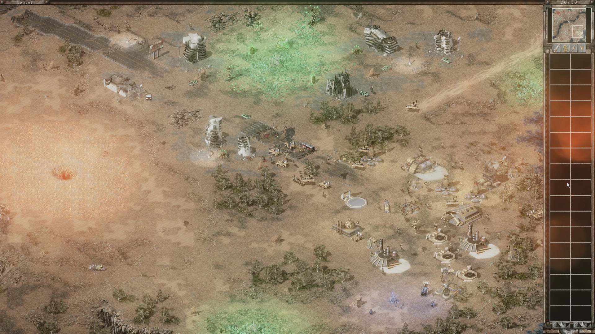 Captura de pantalla del juego mostrando una base desértica con vehículos militares, estructuras e interfaz del mod Tiberian War WarZone