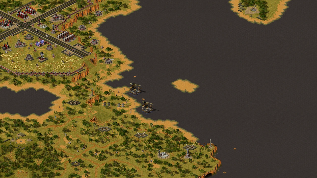 Draufsicht auf eine befestigte Basis mit Verteidigungsanlagen und Öltürmen auf einer Küstenkarte im Alliance Reforged Mod