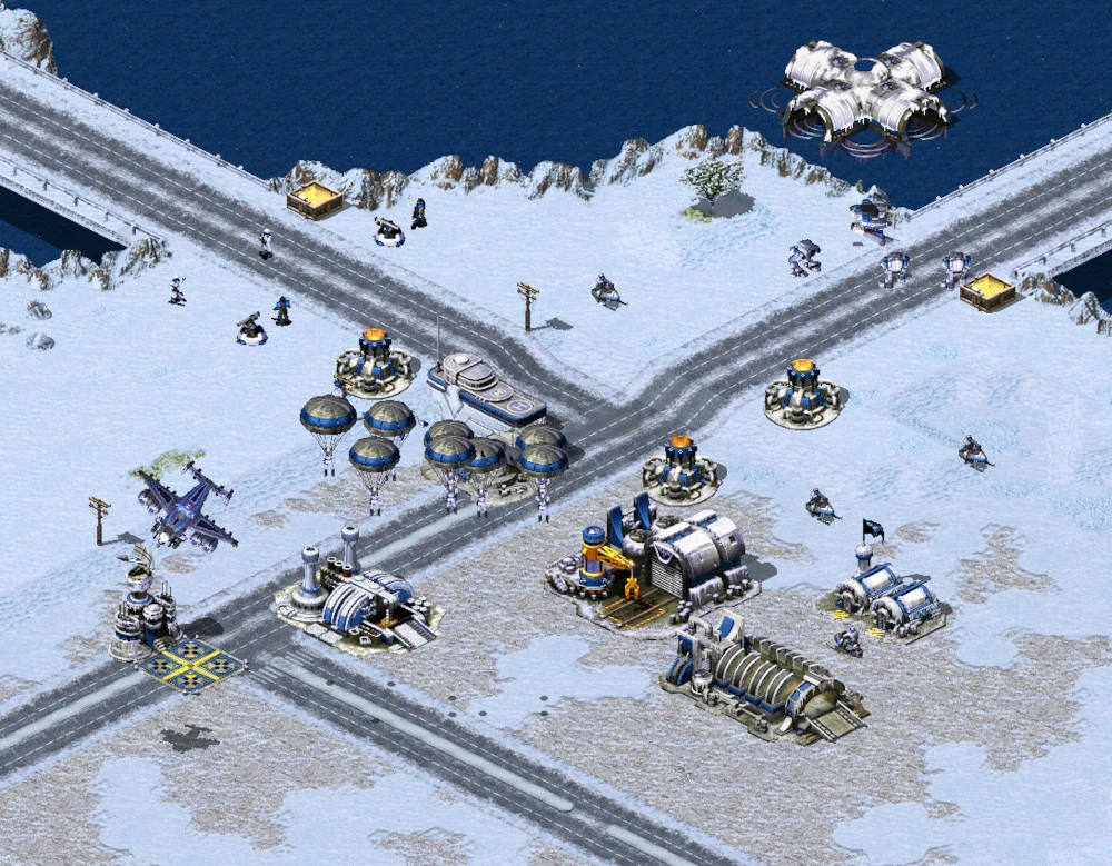 Zaśnieżona mapa Command & Conquer Yuri's Revenge z budynkami, drogami, spadochroniarzami i bazą wodną