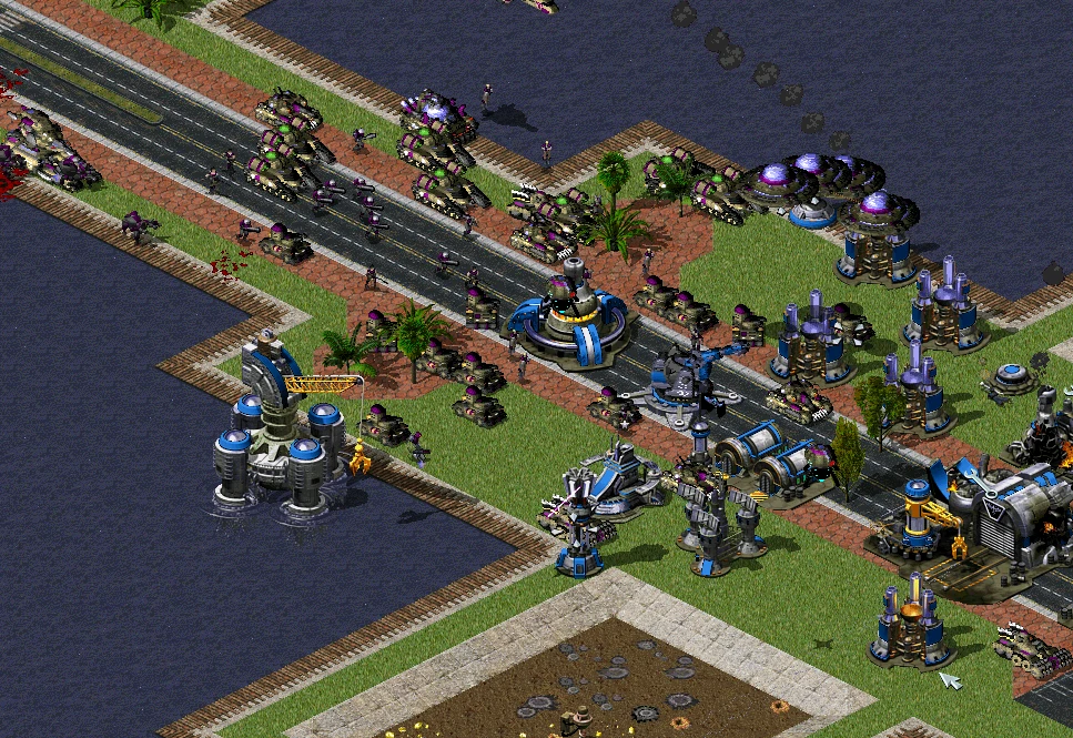 Screenshot of Command & Conquer Yuri's Revenge showing tanks, infantry, and buildings in a strategic base battle
