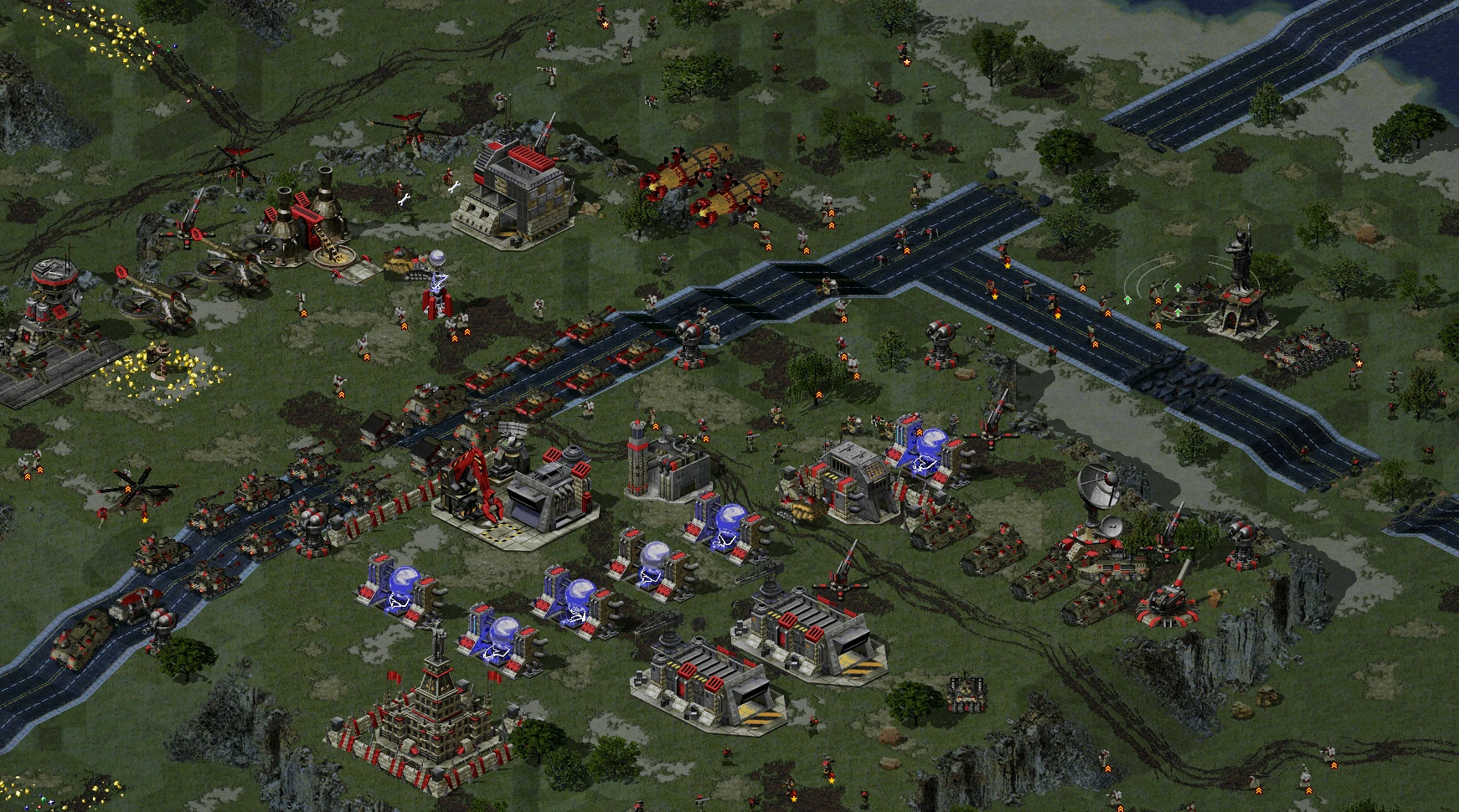 Top-down view of Command & Conquer: Yuri's Revenge with tanks, helicopters, and buildings in a large base in Final War mod
