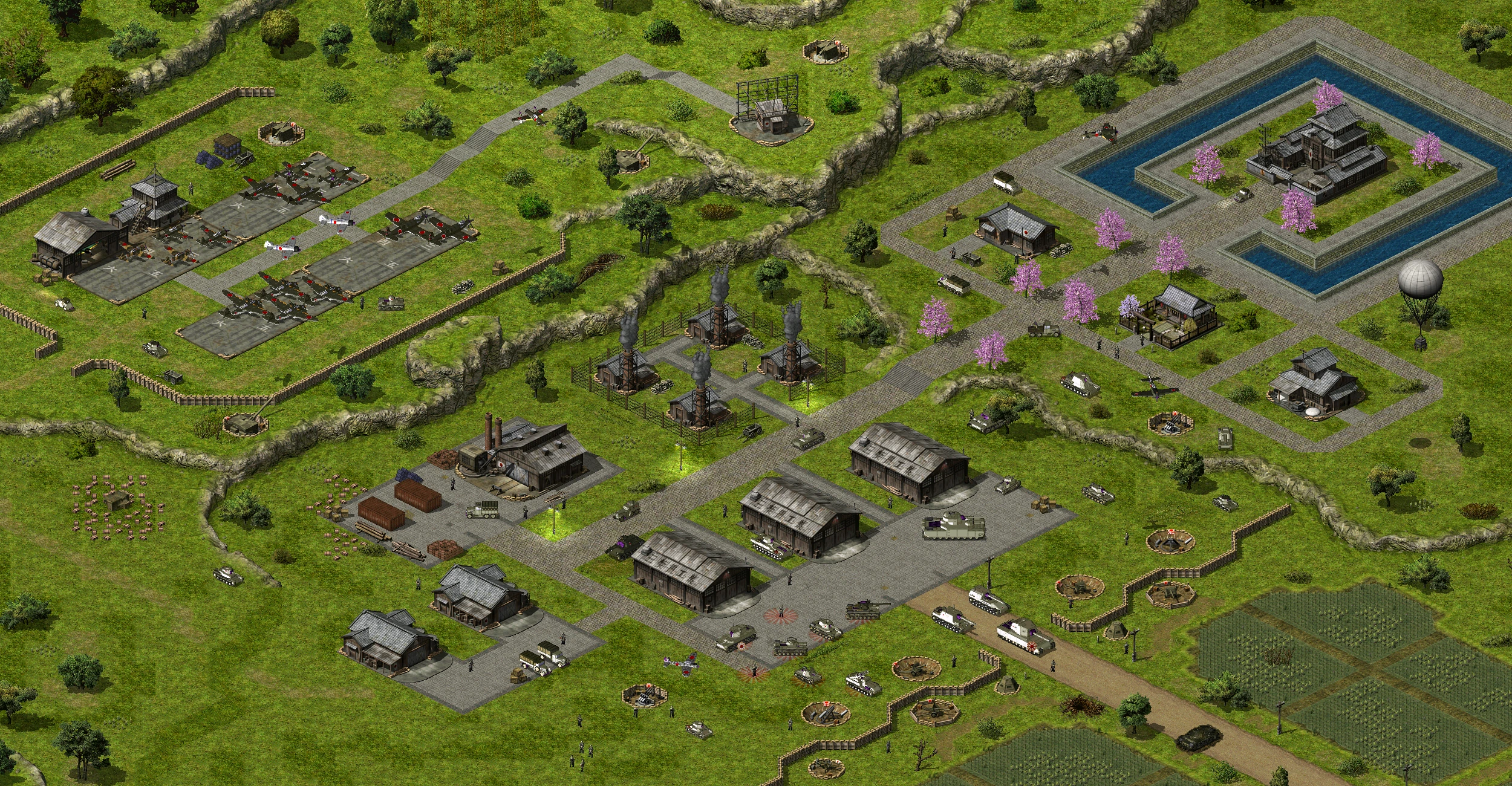 Draufsicht auf eine detaillierte Militärbasis mit Flugzeugen, Panzern und Verteidigungsanlagen im Command & Conquer Yuri's Revenge Mod