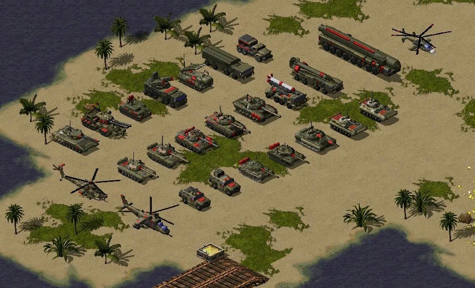 Una alineación de tanques, lanzamisiles, camiones y helicópteros en terreno arenoso en el mod de Command & Conquer Yuri's Revenge