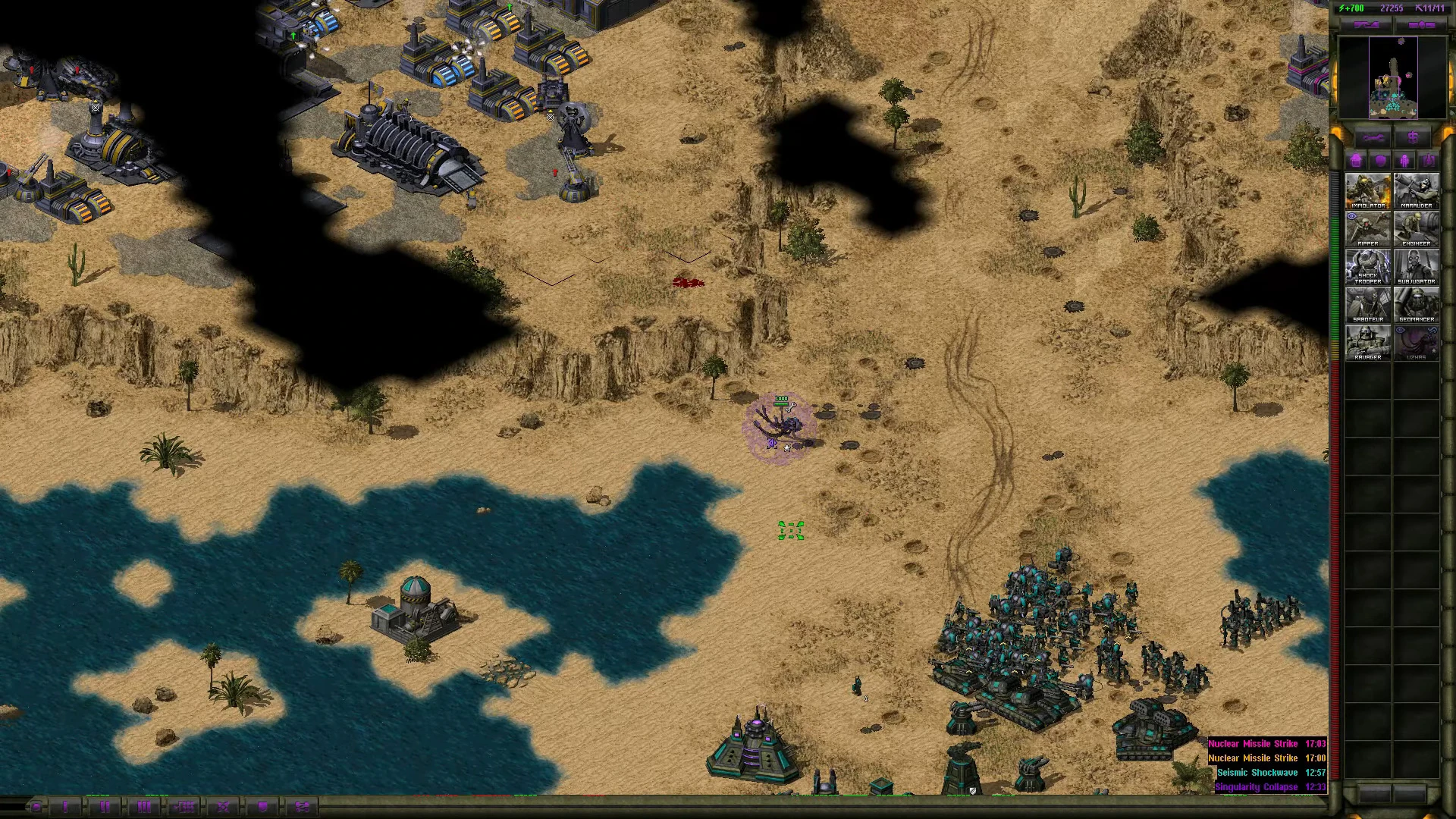 Top-down view of military units grouped near desert cliffs and water body in Command & Conquer Yuri's Revenge mod