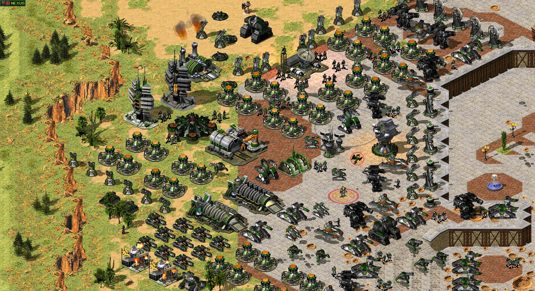 Widok z góry na dużą ufortyfikowaną bazę z zielono-czarnymi strukturami obronnymi i jednostkami w modzie Reboot do Yuri's Revenge