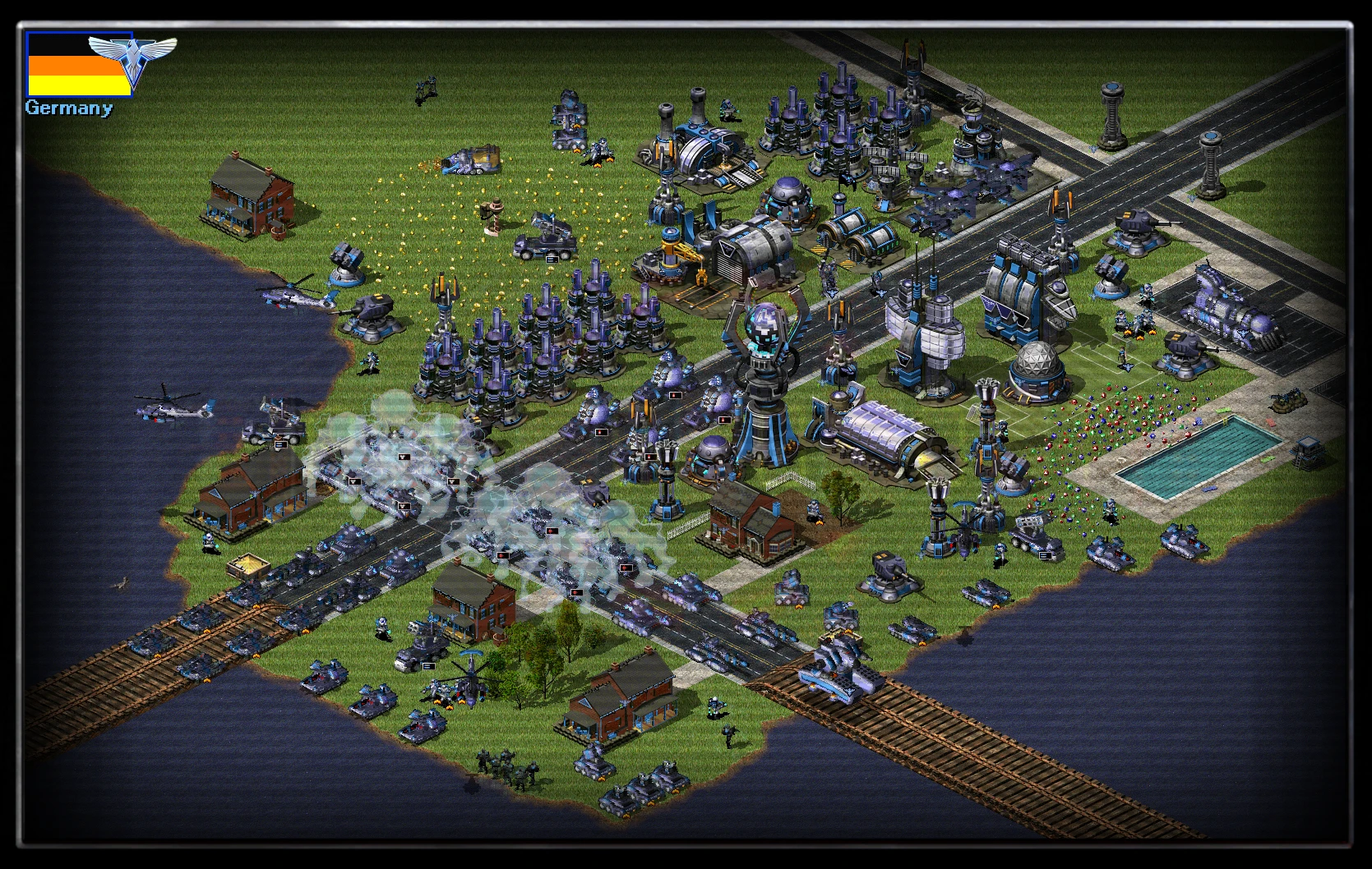 Zrzut ekranu dużej bazy z wieloma budynkami oraz dziesiątkami pojazdów wojskowych i piechoty w walce moda Reboot do Command & Conquer Yuri's Revenge