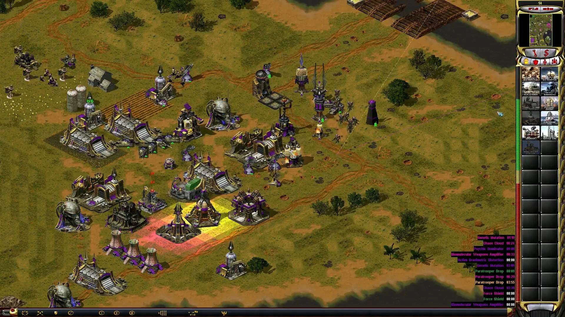 A strategic base with buildings and units near a river in Command & Conquer: Yuri's Revenge mod Red Alert 2 Apocalypse