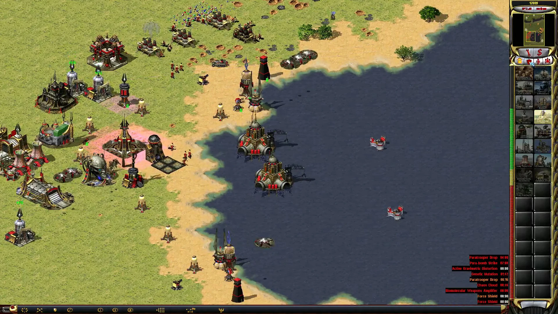 Screenshot of a coastal military base with defensive turrets and structures in Command & Conquer Yuri's Revenge mod