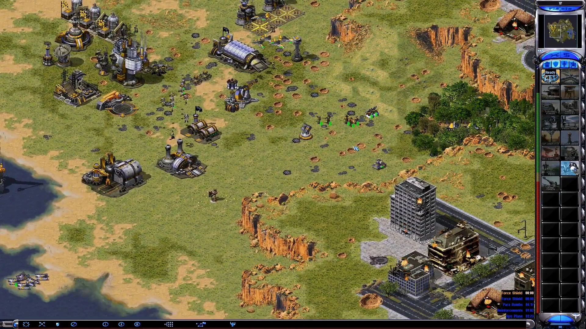 Overhead view of a battlefield with structures, units, and interface from Command & Conquer Yuri's Revenge mod Red Alert 2 Apocalypse