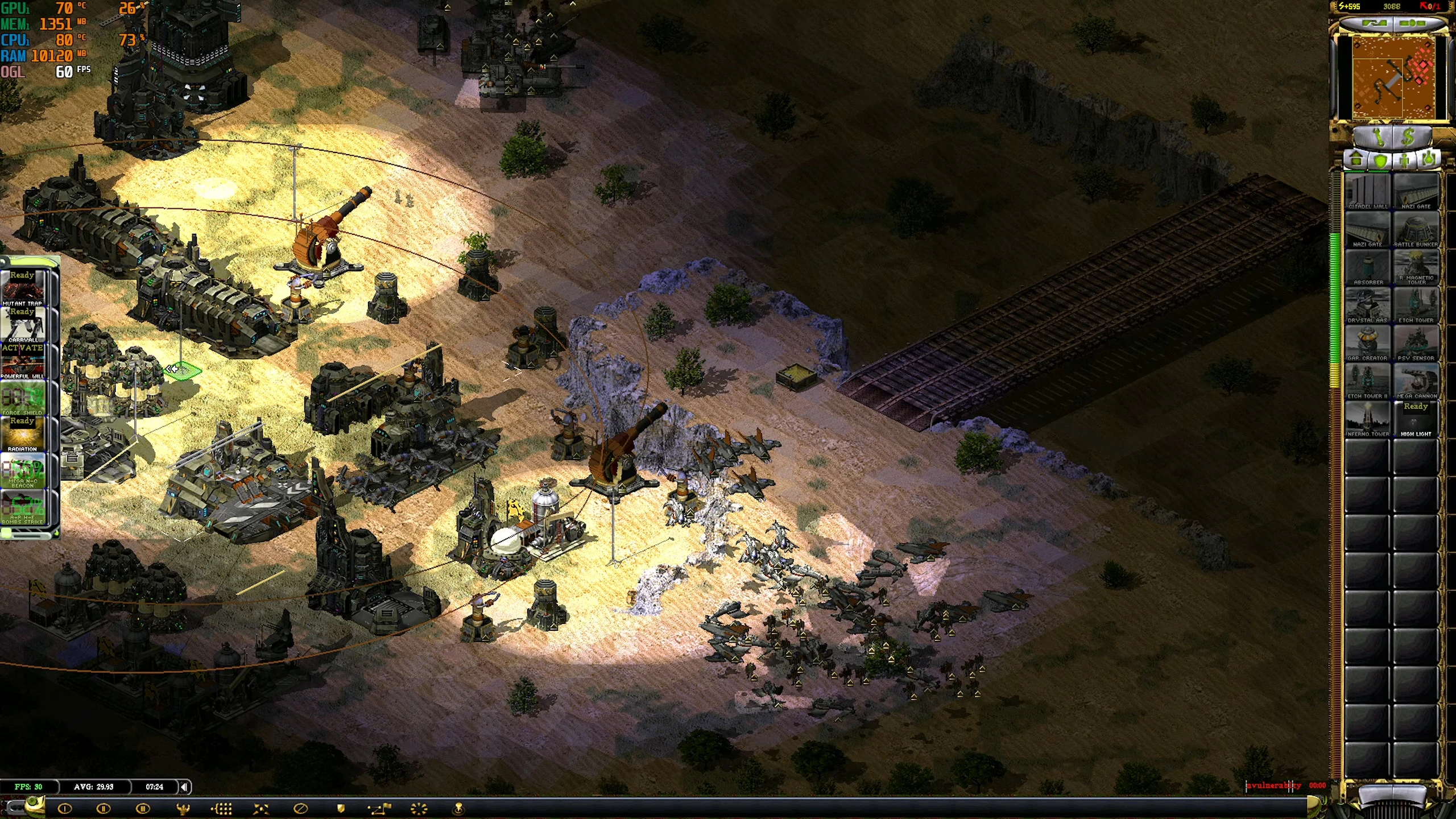 Zrzut ekranu gry pokazujący bazę obronną z ciężką artylerią i wieżyczkami przeciwlotniczymi w modzie Technology Revolution do Command & Conquer Yuri's Revenge