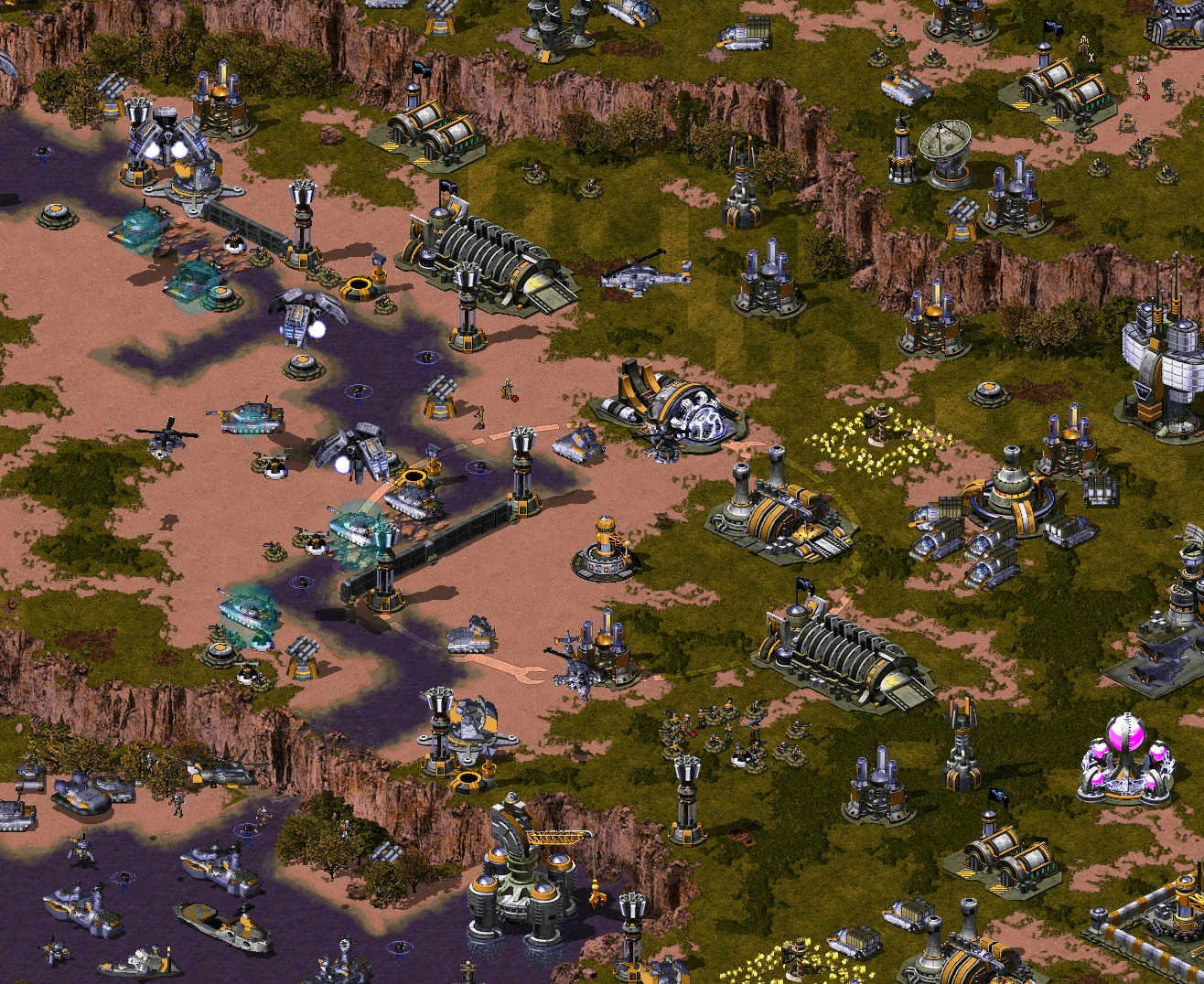 Vista desde arriba de una base con varios edificios, vehículos y defensas en el mod YR Red-Resurrection de Command & Conquer Yuri's Revenge